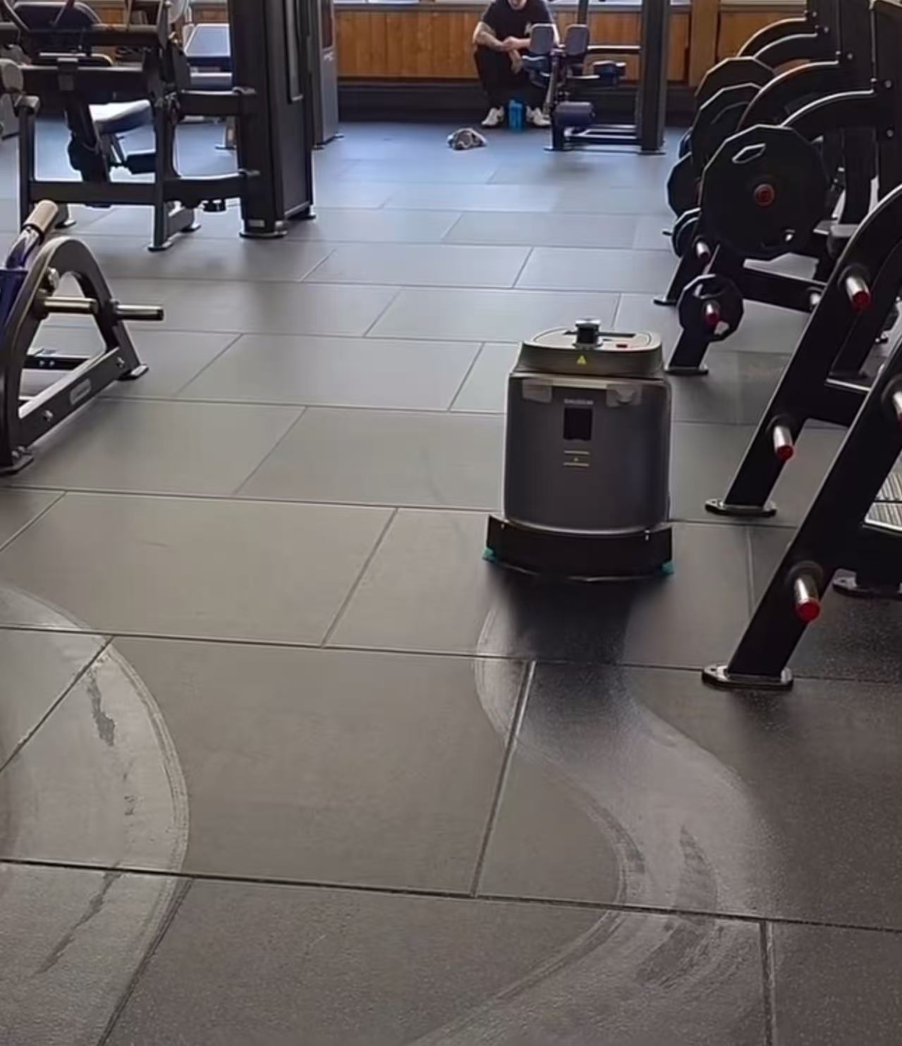Phantas operating in an aisle between strength training machines