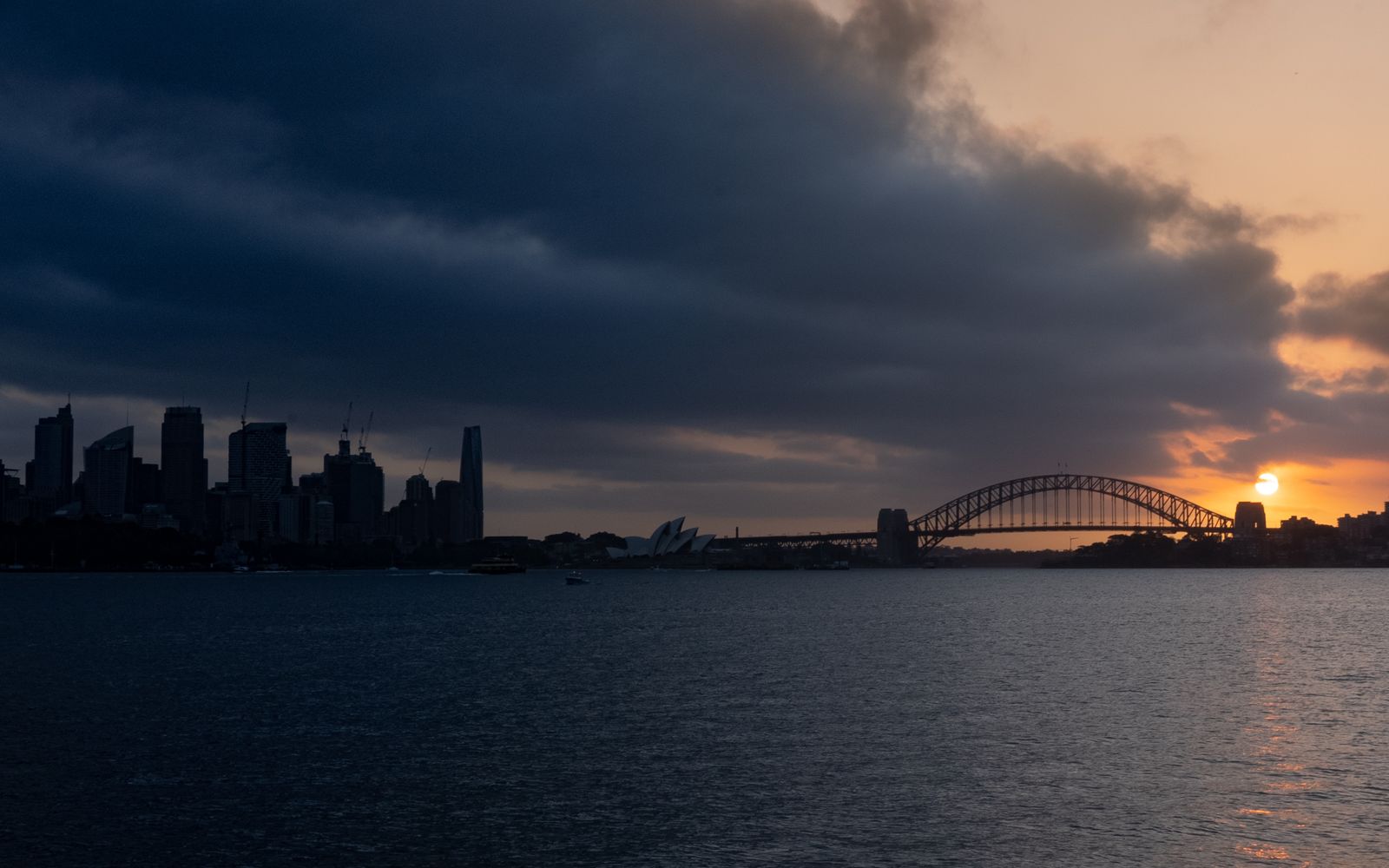 Sydney Harbour skyline at sunset; geographic context